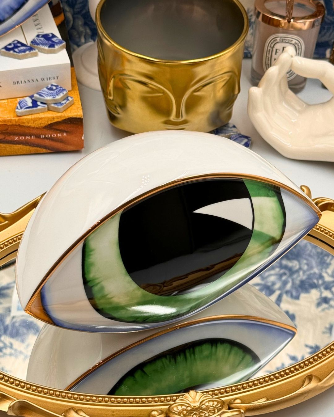 Angled view of green All-Seeing Eye Porcelain Paperweight