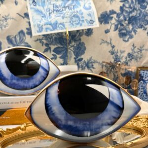Blue All-Seeing Eye porcelain paperweight with gold-leaf detailing, front view