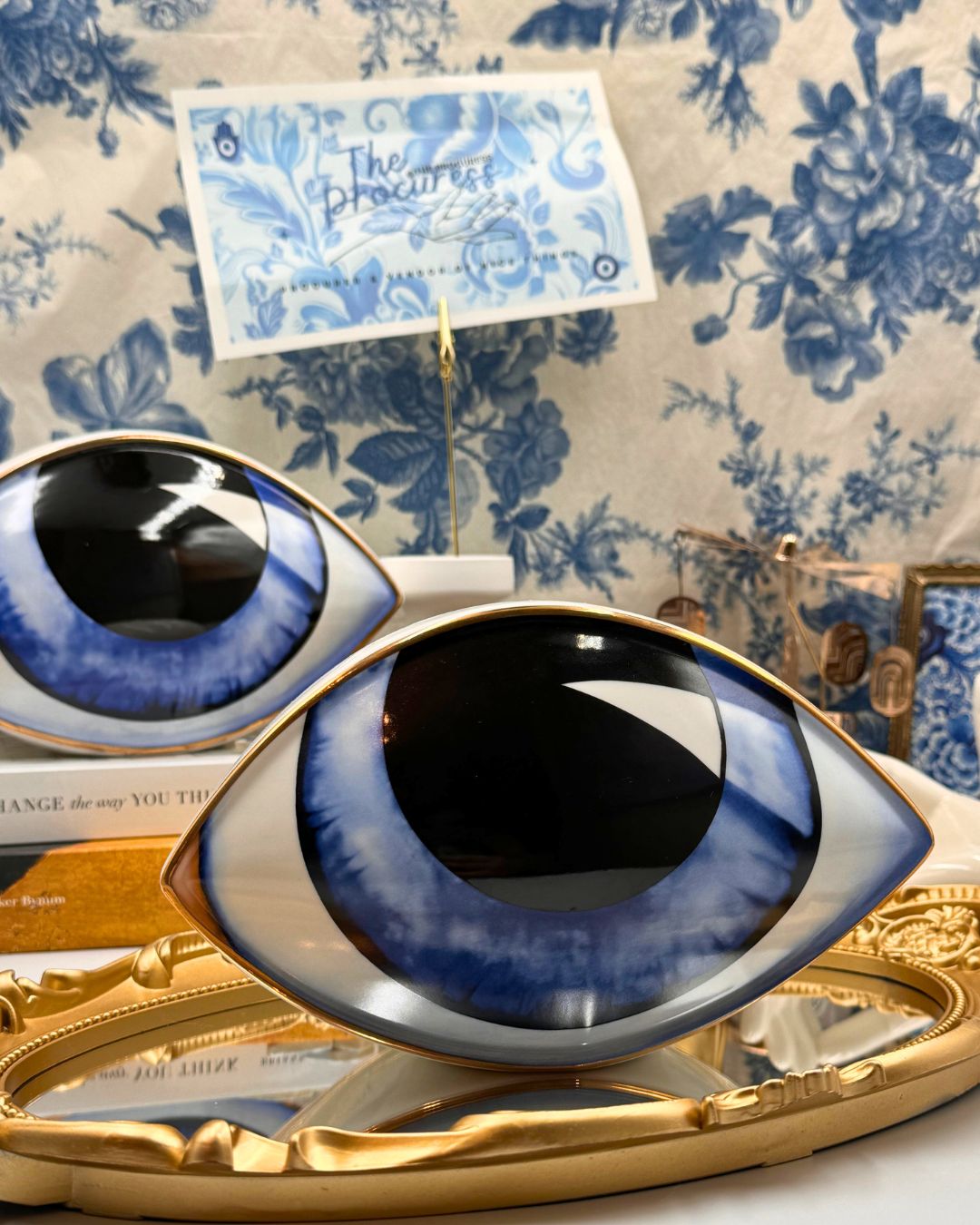 Blue All-Seeing Eye porcelain paperweight with gold-leaf detailing, front view
