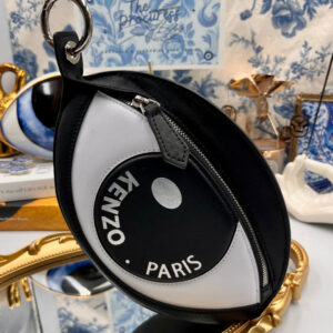 KENZO Kontact Eye leather clip pouch in black and white displayed in a decorative still life