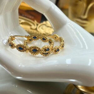 Blue and clear stone embellishment on CRYSTAL HAZE Evil Eye Hoop Earring