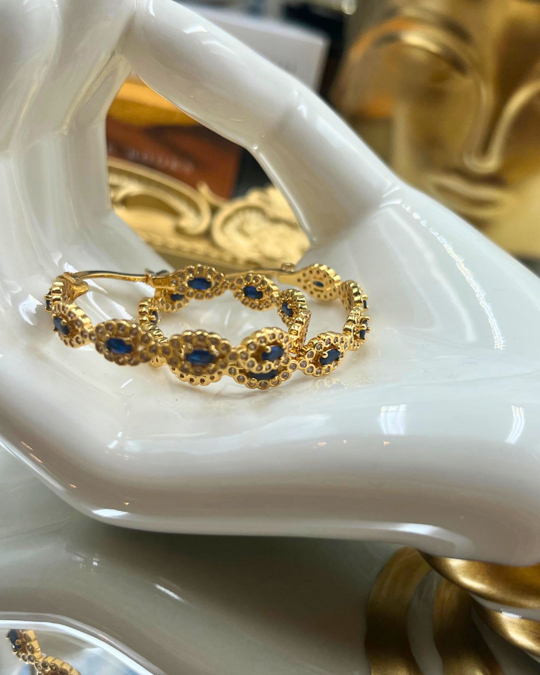 Blue and clear stone embellishment on CRYSTAL HAZE Evil Eye Hoop Earring