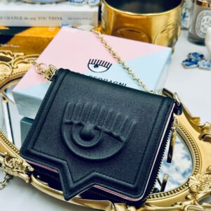Black Chiara Ferragni Eyelike wallet on chain, angled view