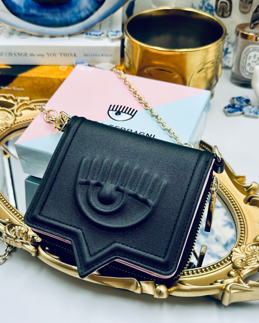 Black Chiara Ferragni Eyelike wallet on chain, angled view