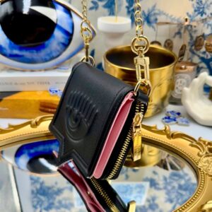 Black Chiara Ferragni Eyelike wallet on chain, side view