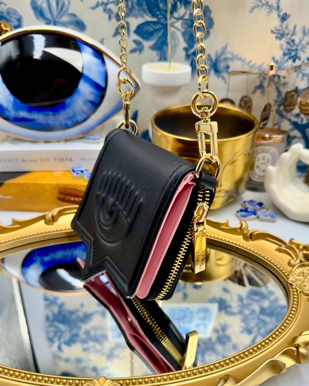 Black Chiara Ferragni Eyelike wallet on chain, side view