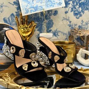 Pair of black GIANNI BINI Penei velvet pearl sandals