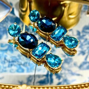 Front view of OSCAR DE LA RENTA gold-tone blue crystal drop earrings