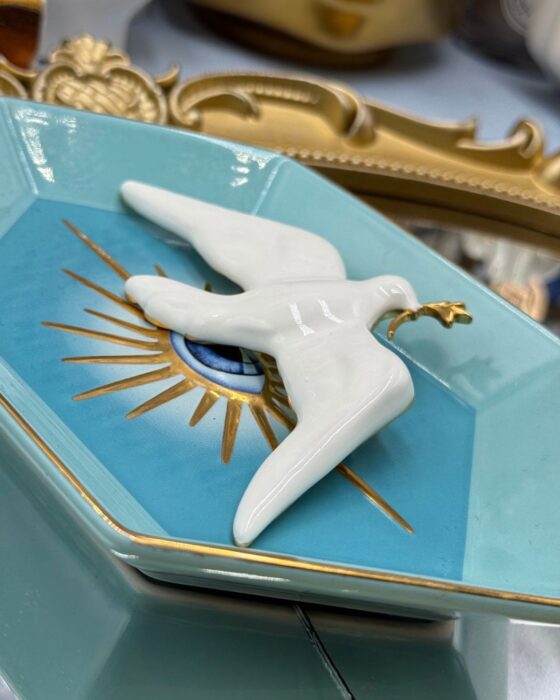 Glossy white enamel finish on sculptural dove brooch