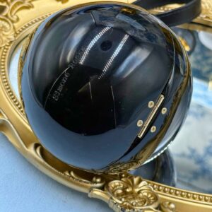 Engraved SIMONE ROCHA logo on black Perspex Egg Clutch