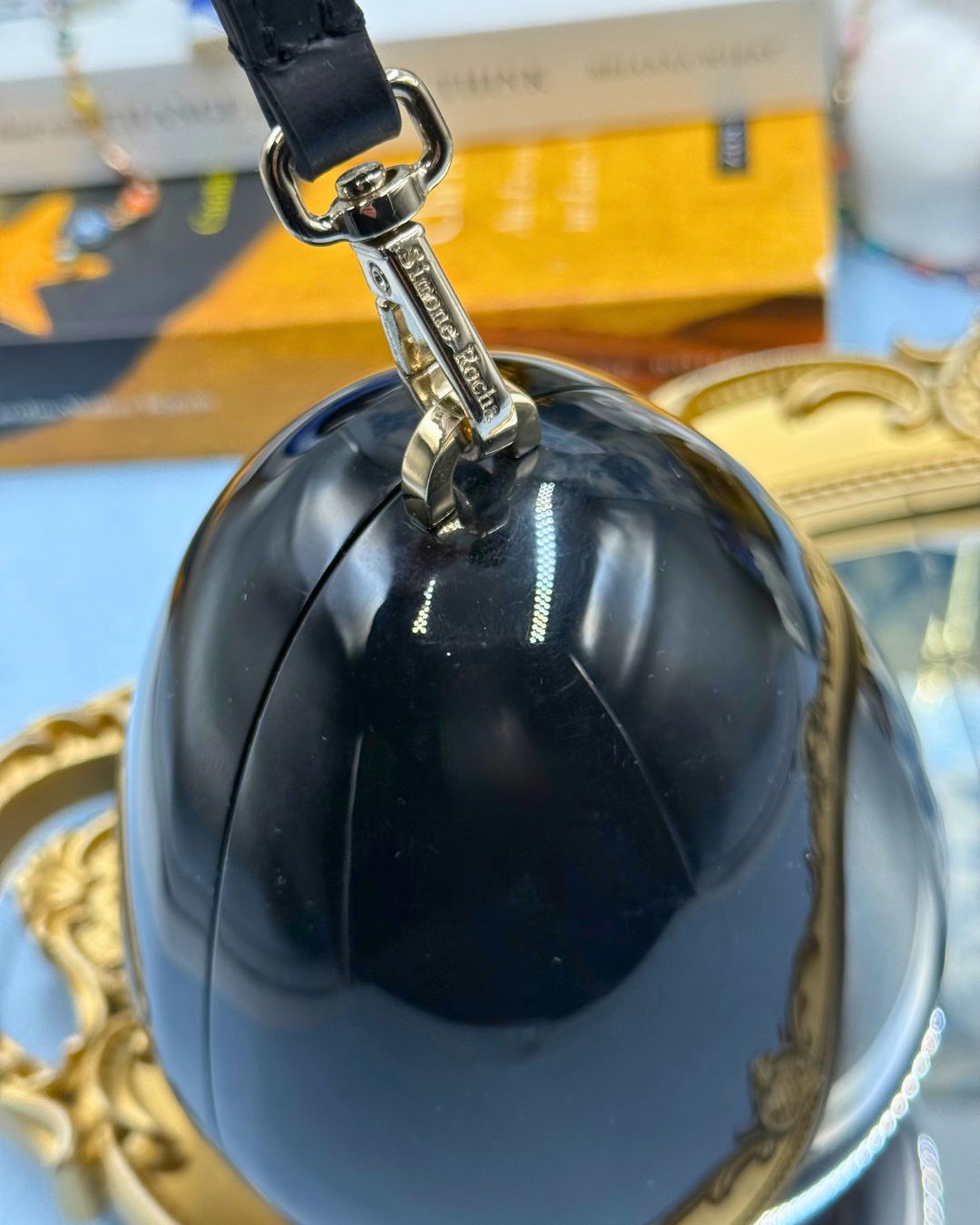 Silver-tone engraved hardware on SIMONE ROCHA Egg Clutch