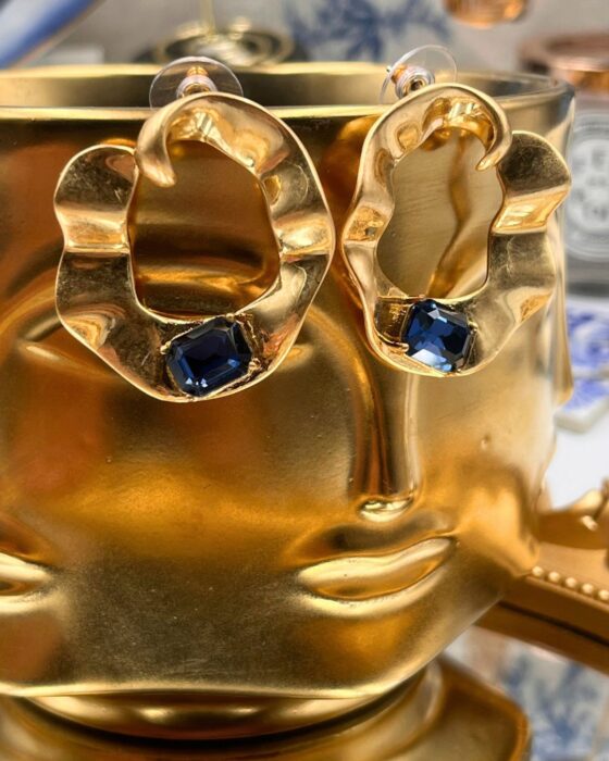 Pair of OSCAR DE LA RENTA sculptural gold O earrings with blue stones