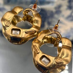 Reverse of OSCAR DE LA RENTA sculptural O earrings with post fastenings