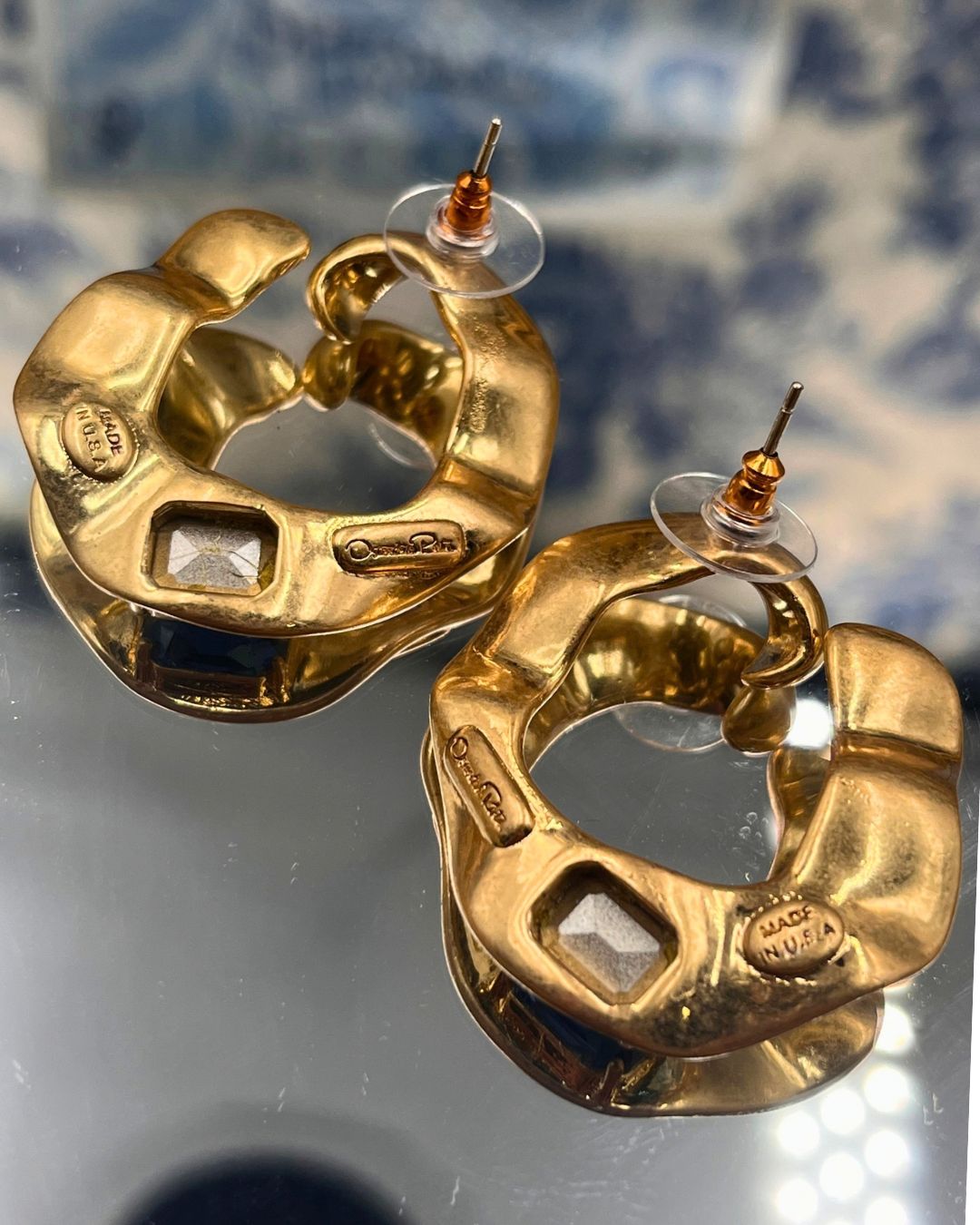 Reverse of OSCAR DE LA RENTA sculptural O earrings with post fastenings