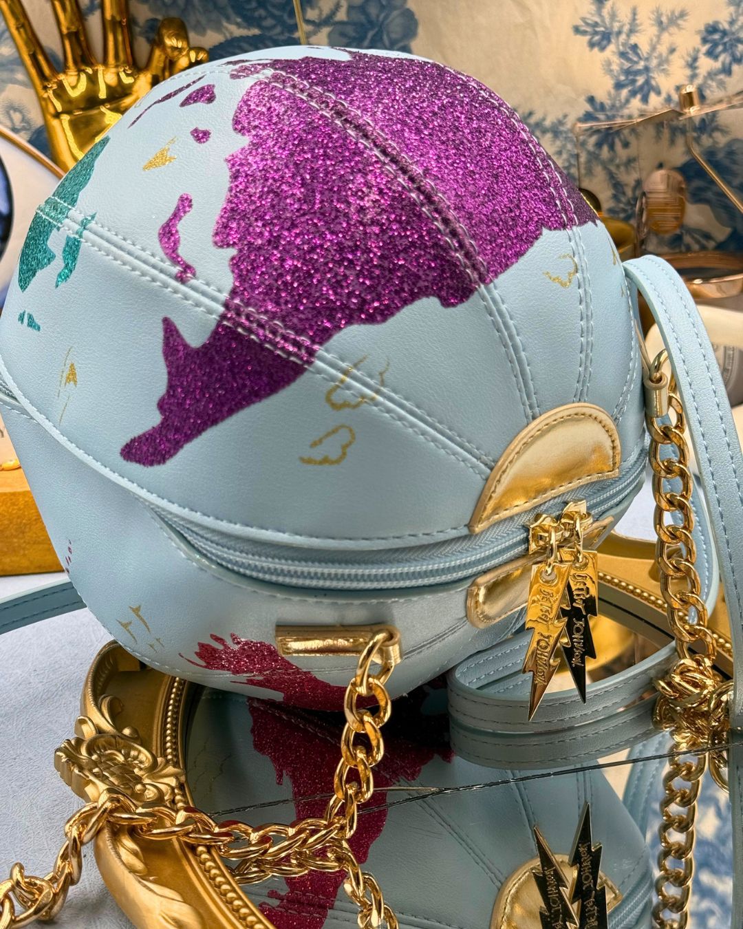 Angled view showing the spherical shape of BETSEY JOHNSON globe bag