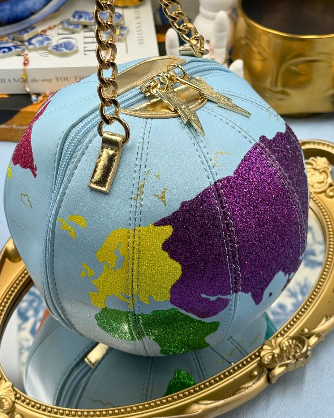 Multicoloured glitter continent detail on BETSEY JOHNSON globe bag