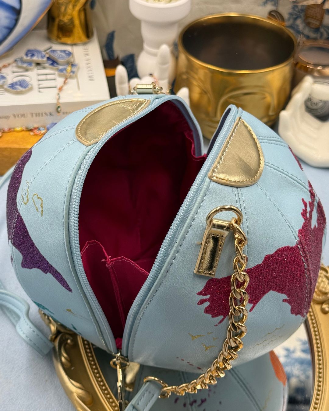 BETSEY JOHNSON Earth To Betsey globe crossbody bag opened to show interior