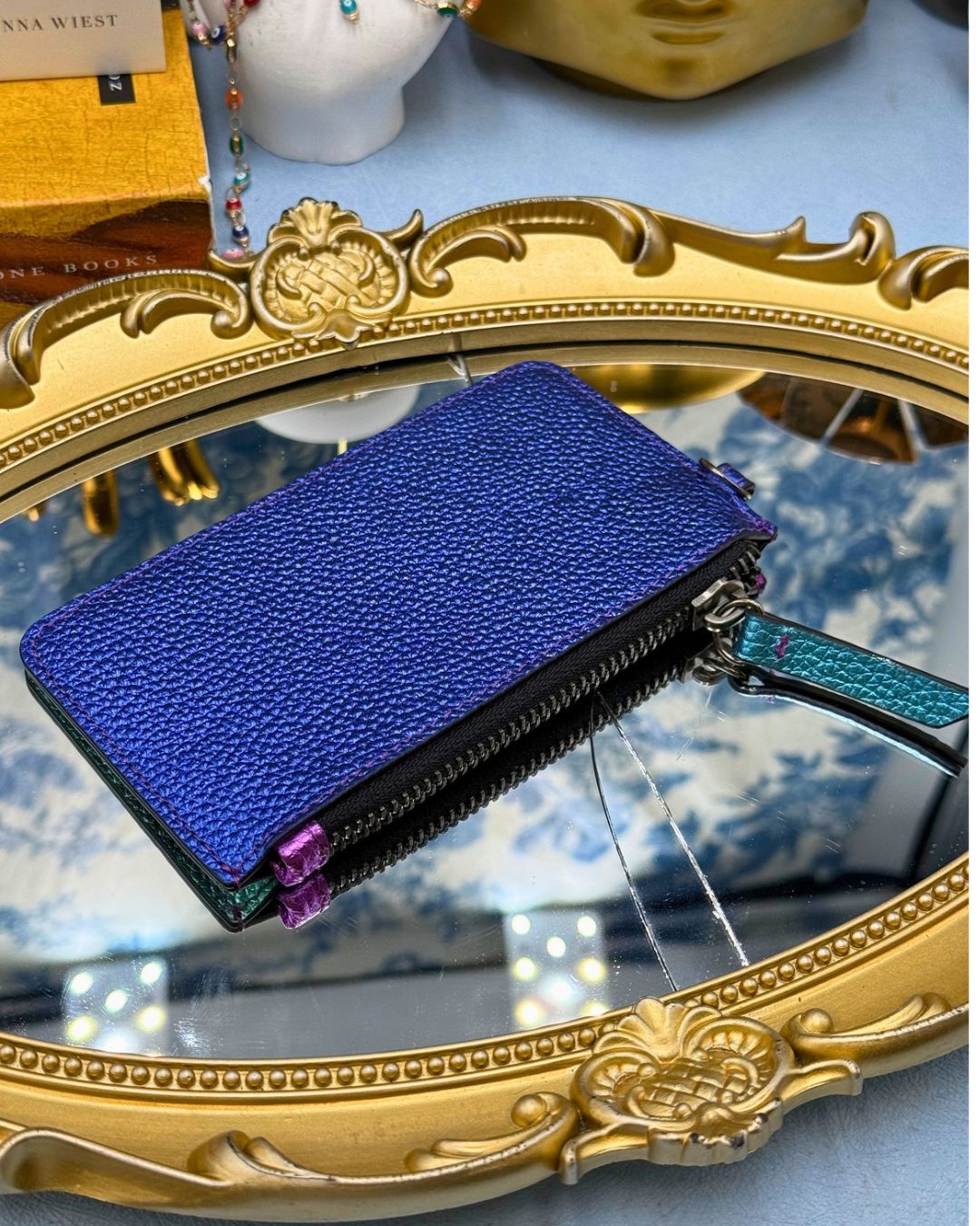 Back of KURT GEIGER LONDON metallic rainbow card holder with exterior card slots