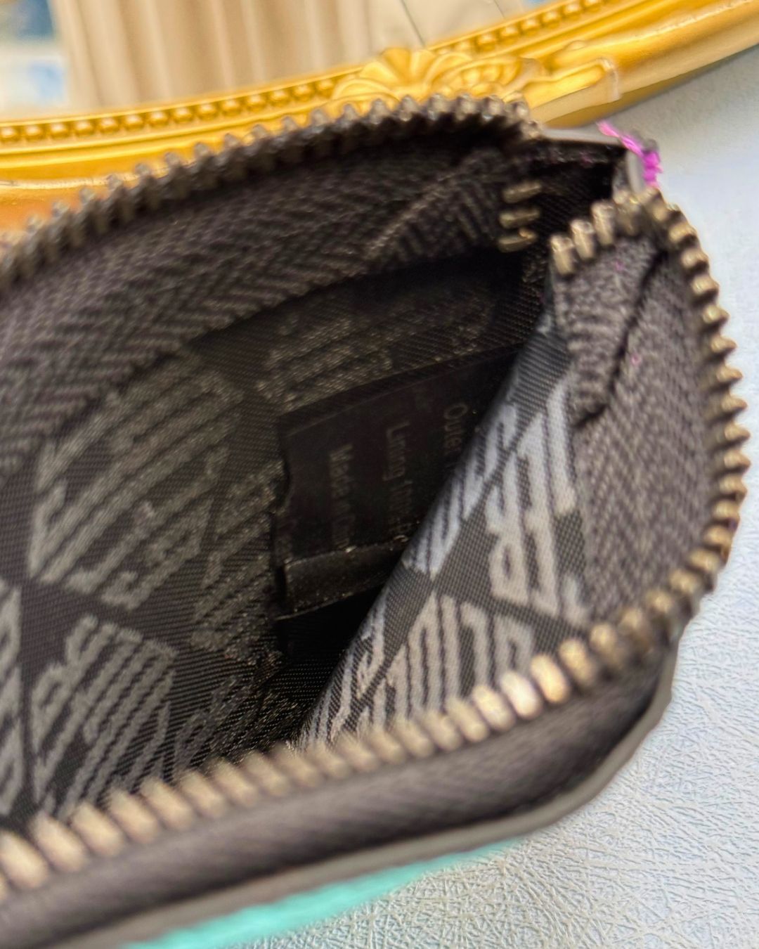 Monogrammed textile lining and clipped label tag inside KURT GEIGER LONDON card holder