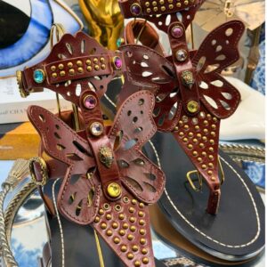 Pierced brown leather butterfly wing detail on KURT GEIGER LONDON sandal