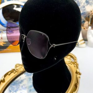 ALEXANDER McQUEEN AM0366S butterfly sunglasses in black metal with pink lenses, modelled