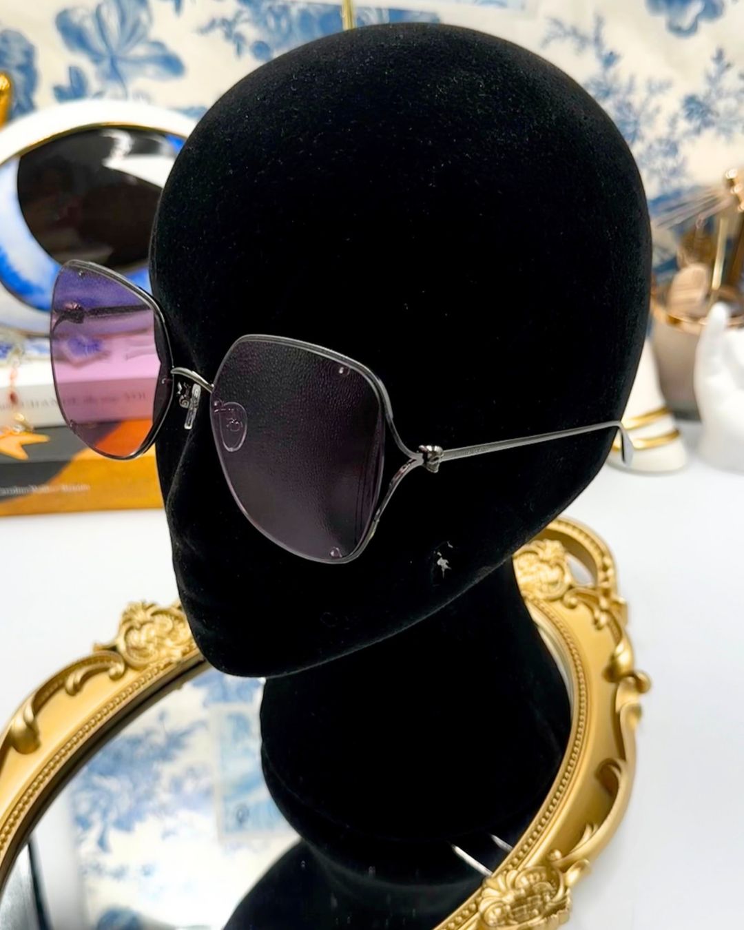 ALEXANDER McQUEEN AM0366S butterfly sunglasses in black metal with pink lenses, modelled