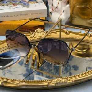 ALEXANDER McQUEEN AM0366S butterfly sunglasses in black metal with grey gradient lenses, side view