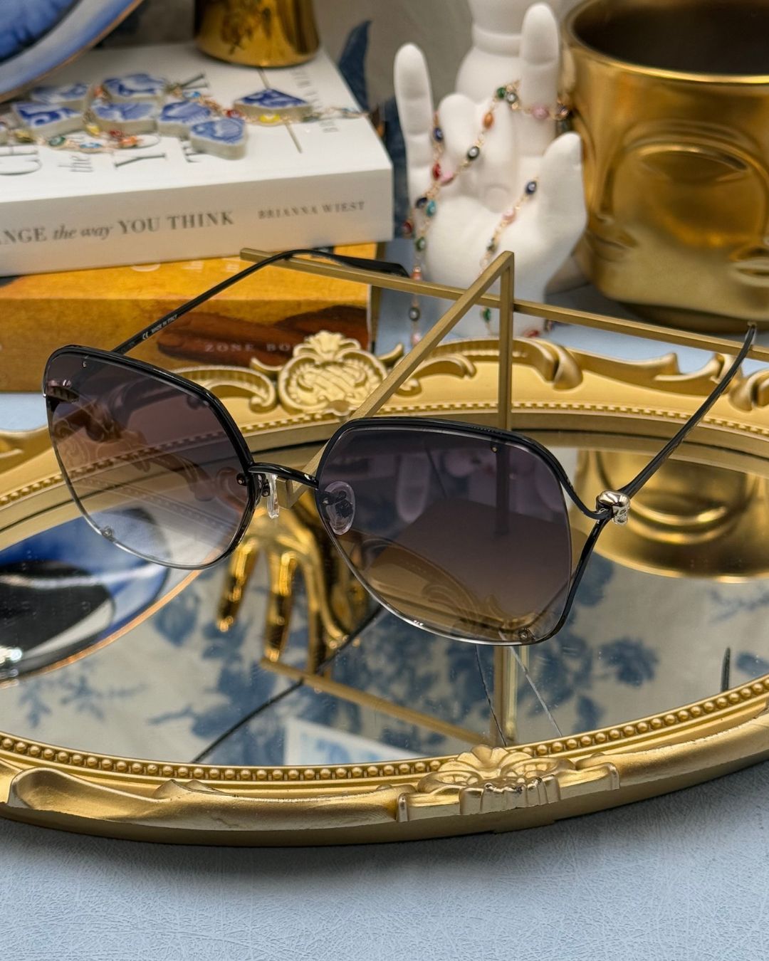 ALEXANDER McQUEEN AM0366S butterfly sunglasses in black metal with grey gradient lenses, side view