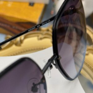 ALEXANDER McQUEEN AM0366S butterfly sunglasses in black metal with grey gradient lenses, style marking on temple