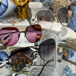 hree colourways of ALEXANDER McQUEEN AM0366S butterfly sunglasses