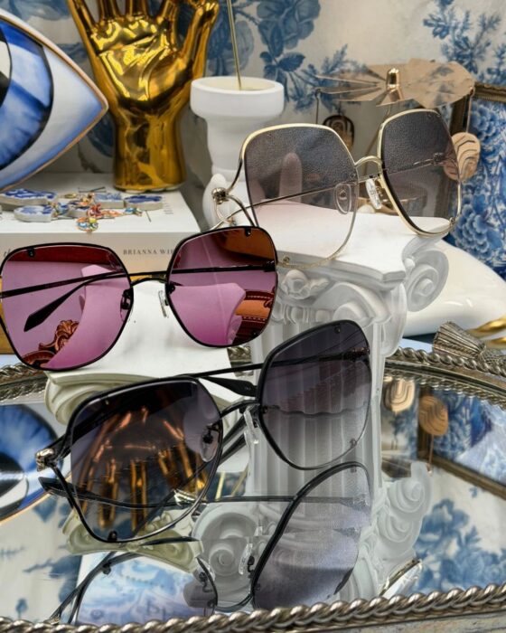 hree colourways of ALEXANDER McQUEEN AM0366S butterfly sunglasses
