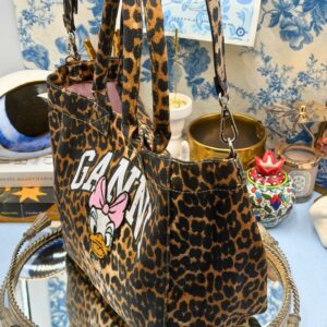 Side view of GANNI x DISNEY Daisy Duck Leopard Small Tote