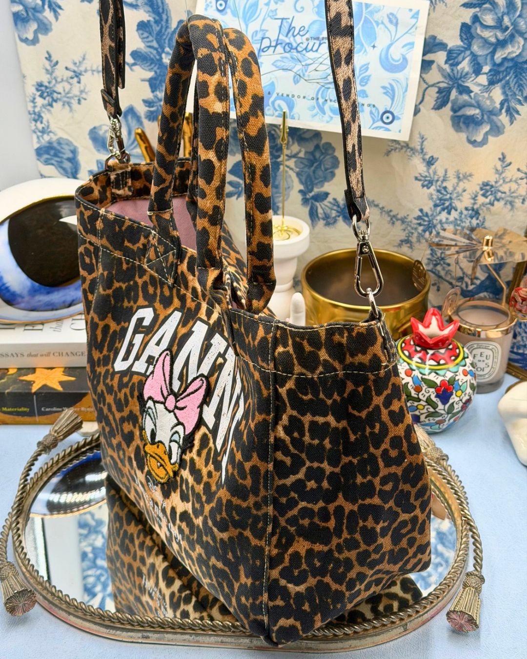 Side view of GANNI x DISNEY Daisy Duck Leopard Small Tote