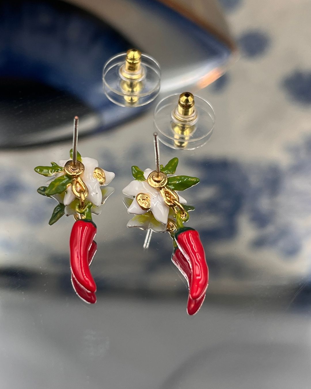 Back view of LES NÉRÉIDES Red Chilli and Lily Flower Earrings