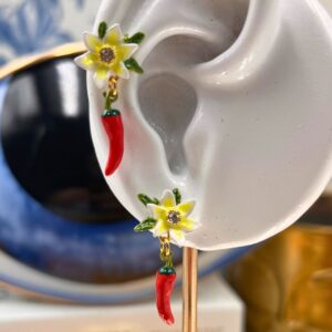 White lily flower detail on LES NÉRÉIDES Red Chilli Earrings