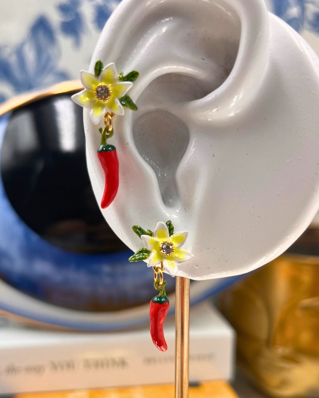 White lily flower detail on LES NÉRÉIDES Red Chilli Earrings