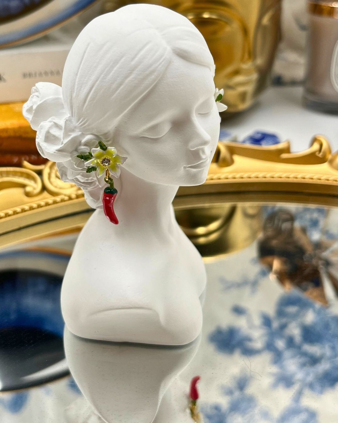 LES NÉRÉIDES Red Chilli and Lily Flower Earrings worn at the ear