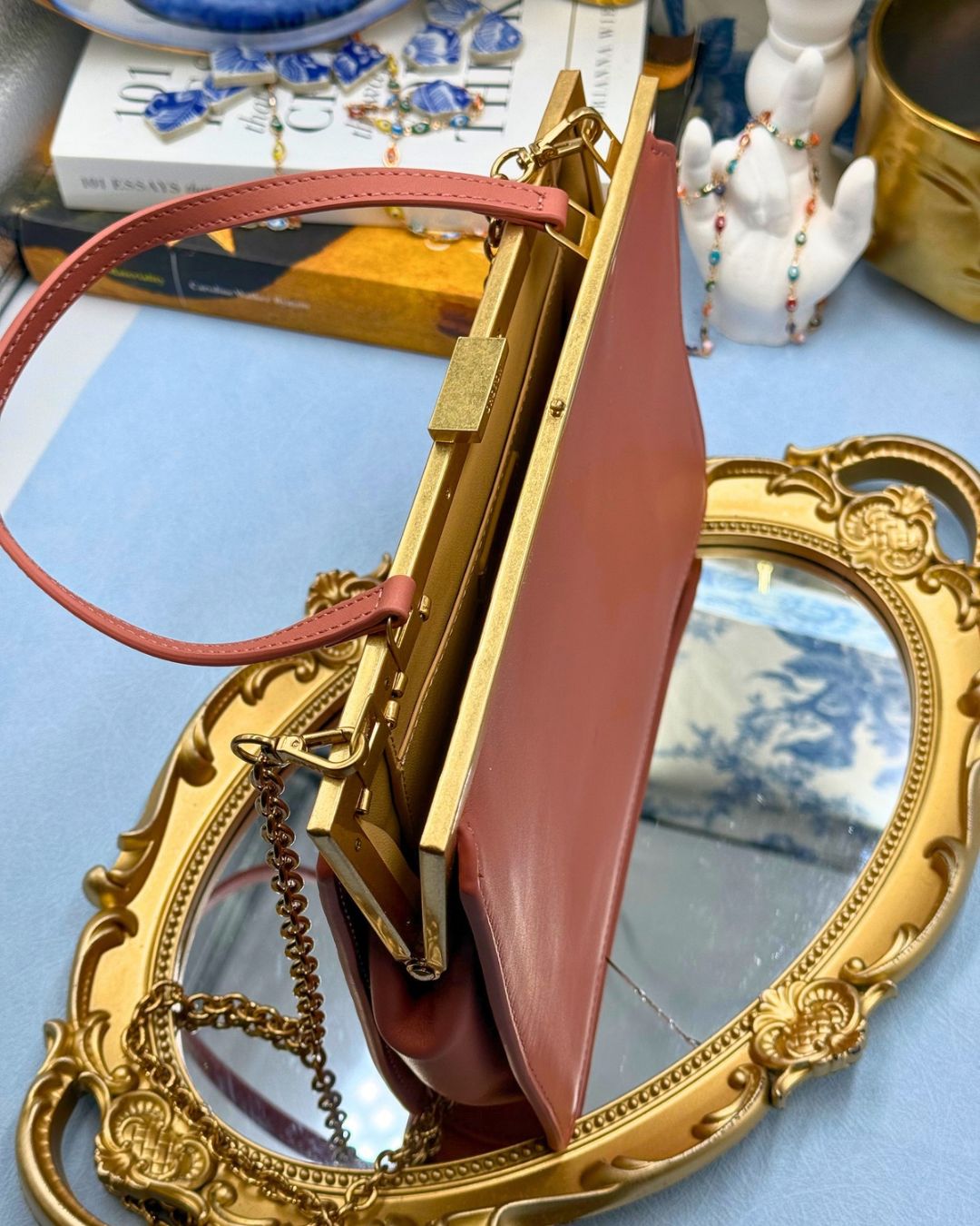 Open view of Black OROTON Icon Frame Clutch