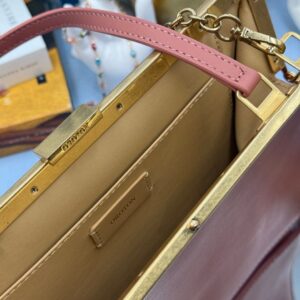Kid-leather interior of Rosewood Pink OROTON Icon Frame Clutch