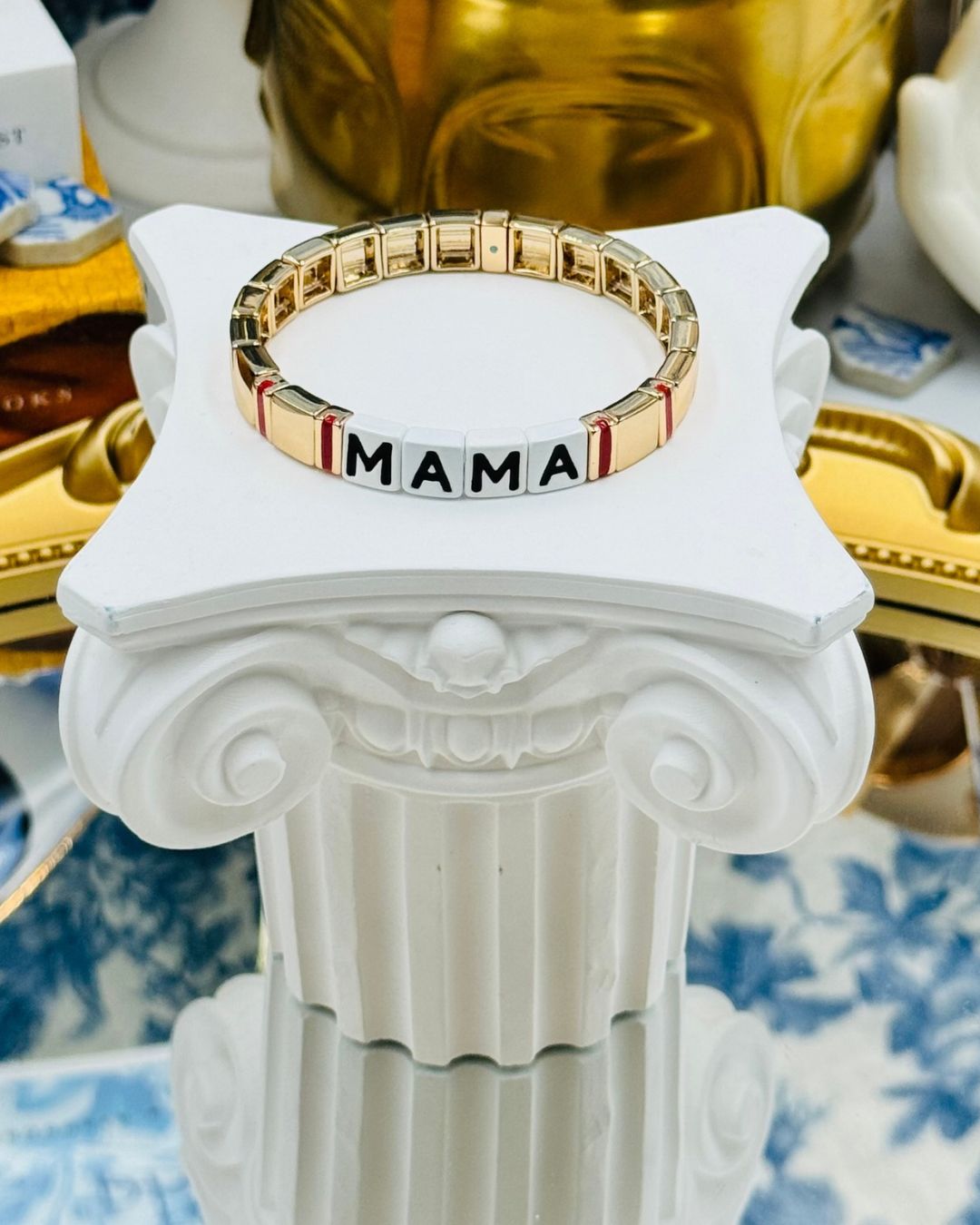Gold stretch bracelet with enamelled MAMA lettering on ROXANNE ASSOULIN bracelet, bracelet 1 of 2