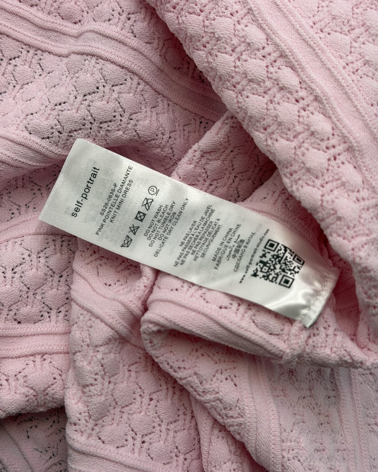 Composition and care label inside SELF-PORTRAIT Pointelle Knit Mini Dress