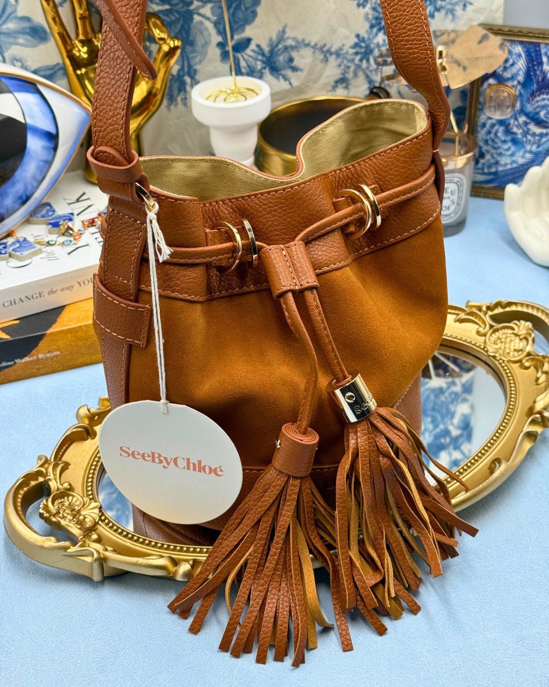Angled view of SEE BY CHLOÉ Vicki Bucket Bag in Caramello