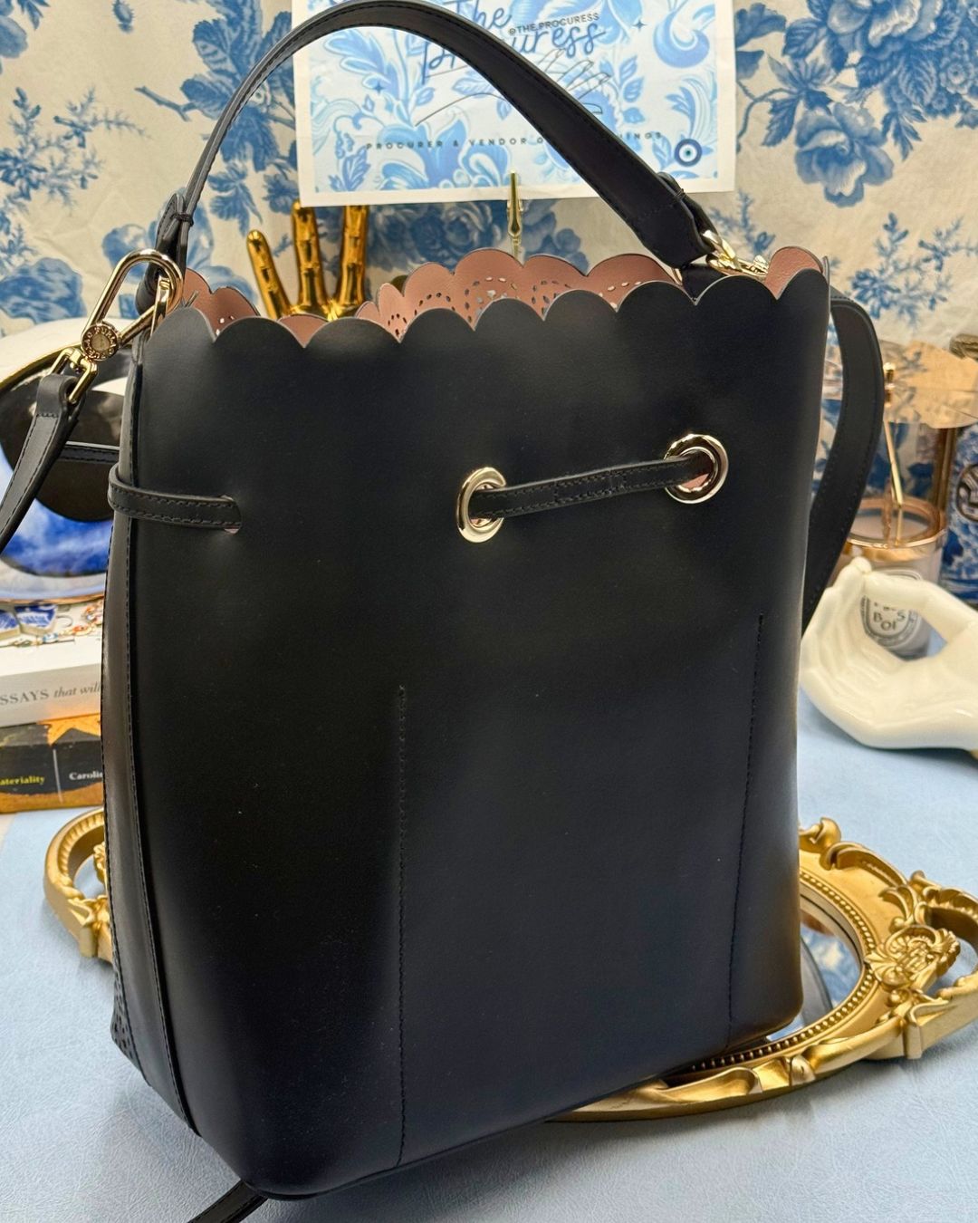 Back view of FURLA Constanza Black Laser-Cut Leather Bucket Bag