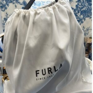 View of FURLA Constanza Black Leather Bucket Bag in FURLA dustbag