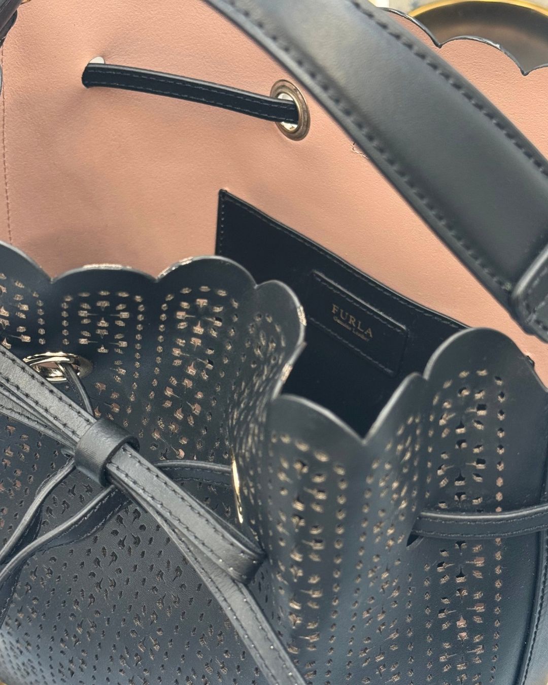 Interior View, with Minor trim wear on FURLA Constanza Black Laser-Cut Leather Bucket Bag