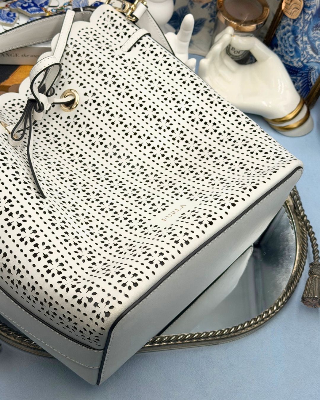 Bottom view of FURLA Constanza Chalk Leather Bucket Bag