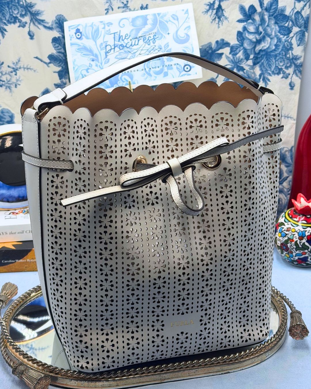 FURLA Constanza Laser-Cut Leather Bucket Bag in Chalk, front view