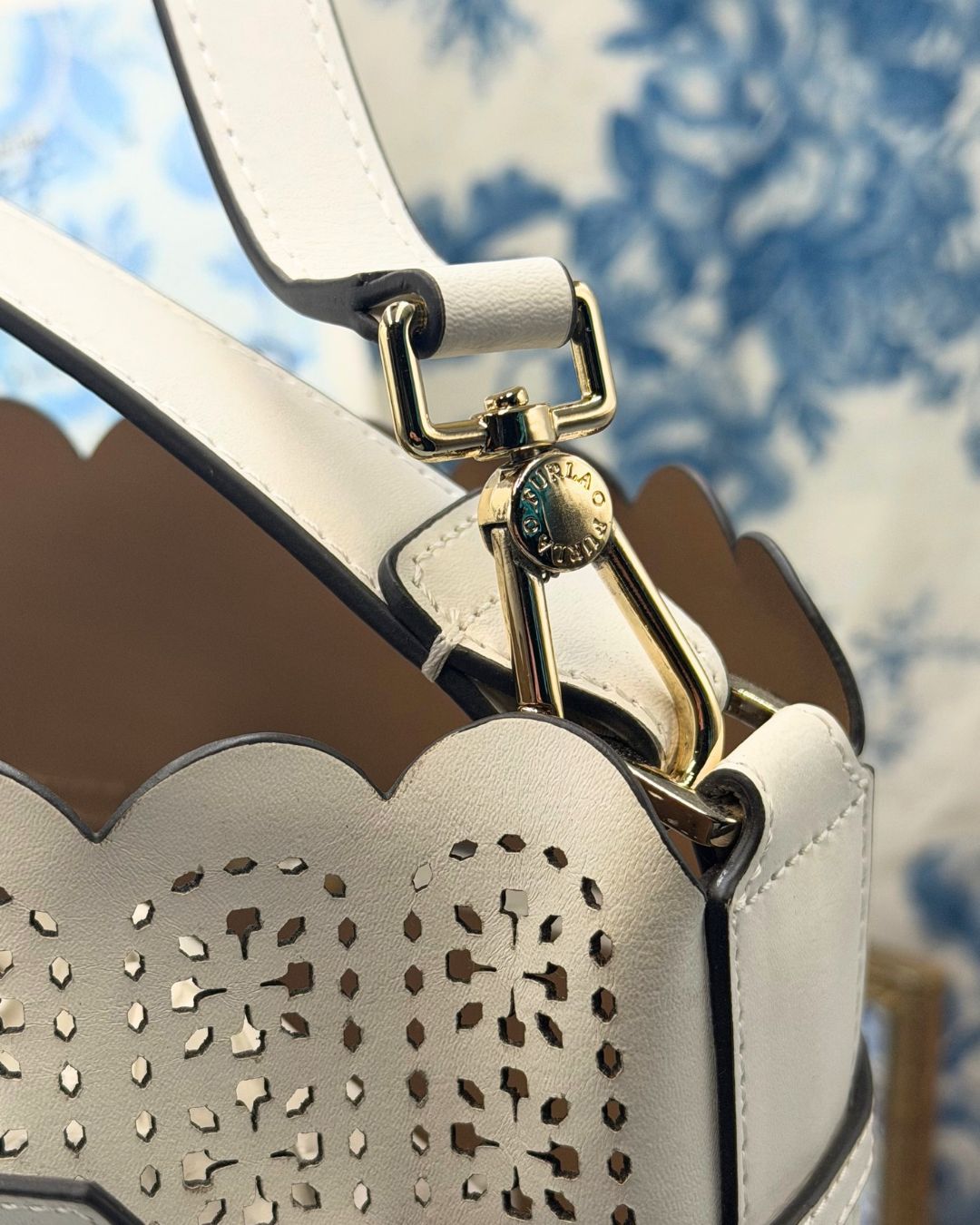 View of FURLA Constanza Chalk Leather Bucket Bag logo hardware