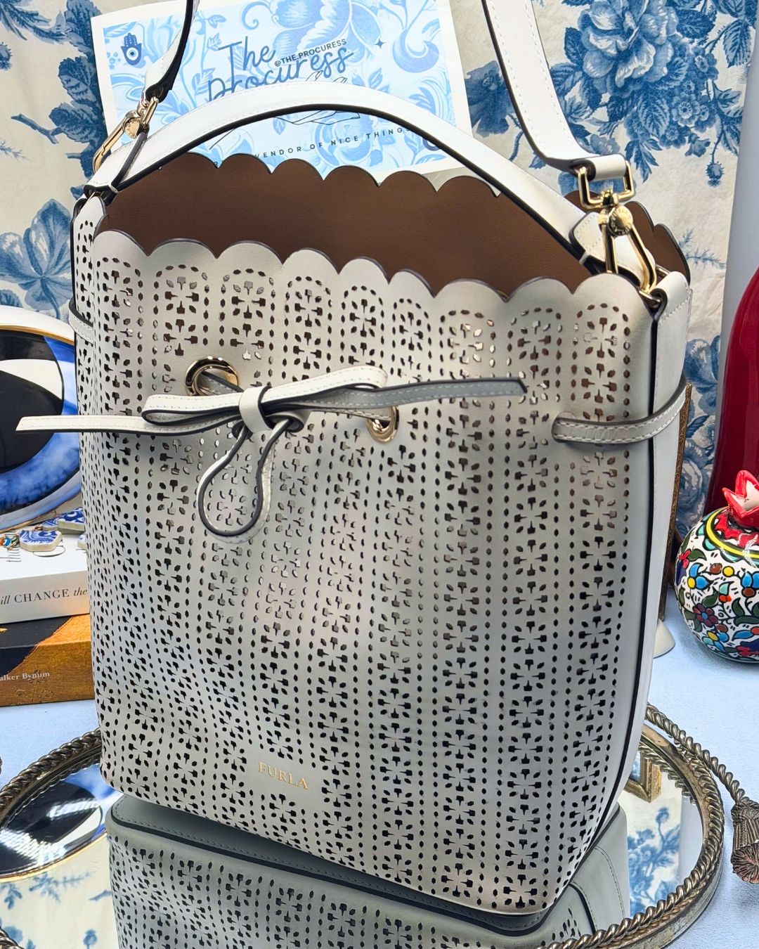 Side view of FURLA Constanza Chalk Leather Bucket Bag