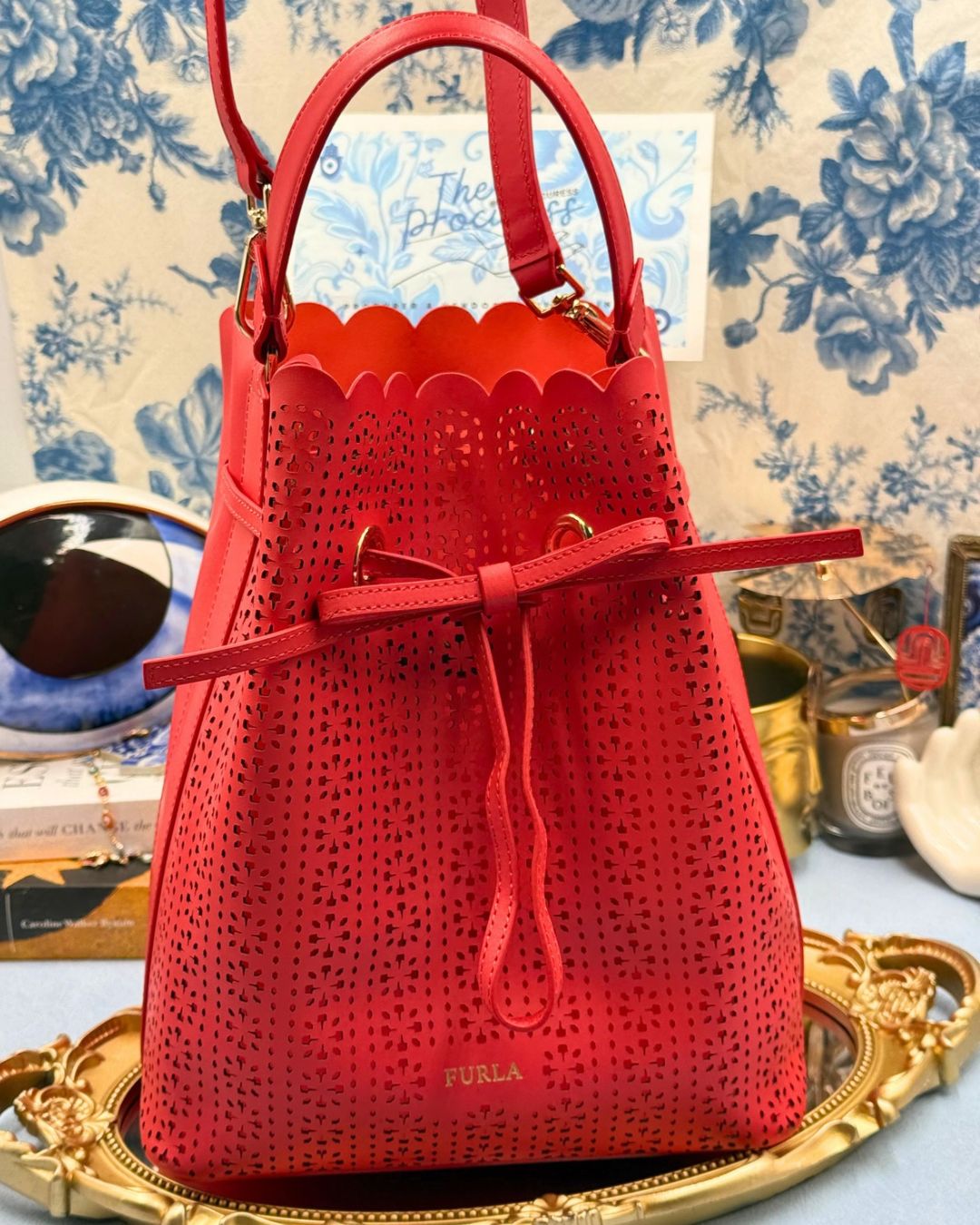 FURLA Constanza Laser-Cut Leather Bucket Bag in Red, front view